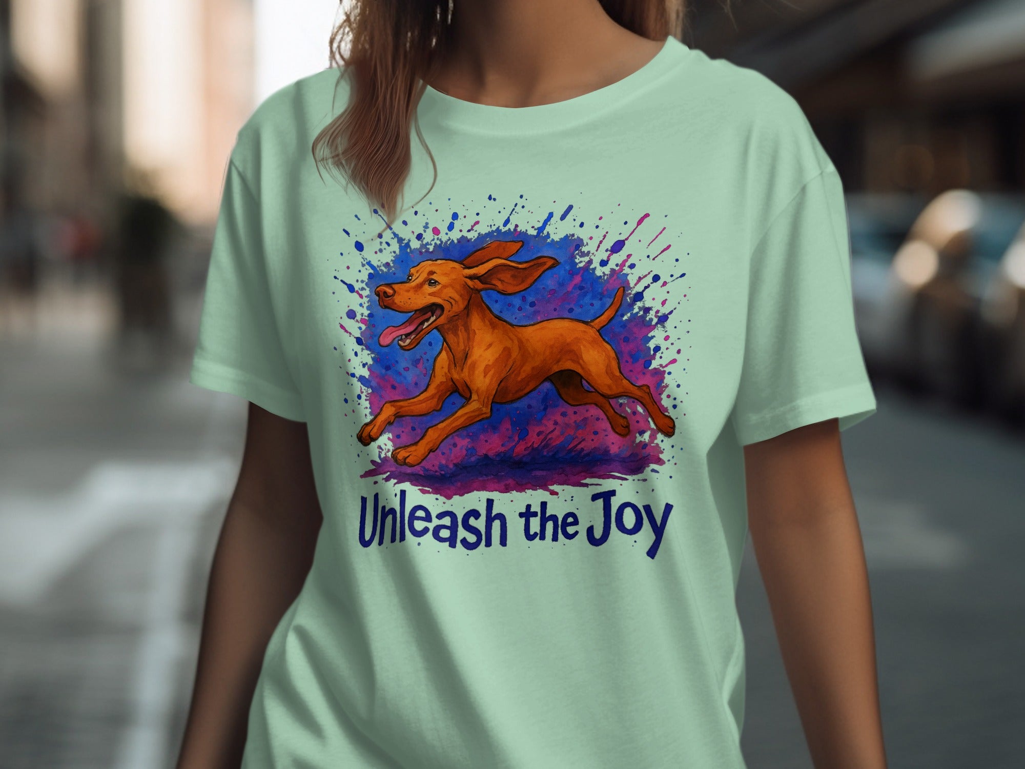 Mint t-shirt with running dog graphic and text "Unleash the Joy".