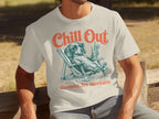 Cream t-shirt with graphic of a dachshund in a lounge chair, "Chill Out" and "Zoomies Are Inevitable."