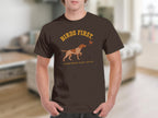 Brown t-shirt with dog and bird graphic, text reads "BIRDS FIRST. EVERYTHING ELSE LATER."