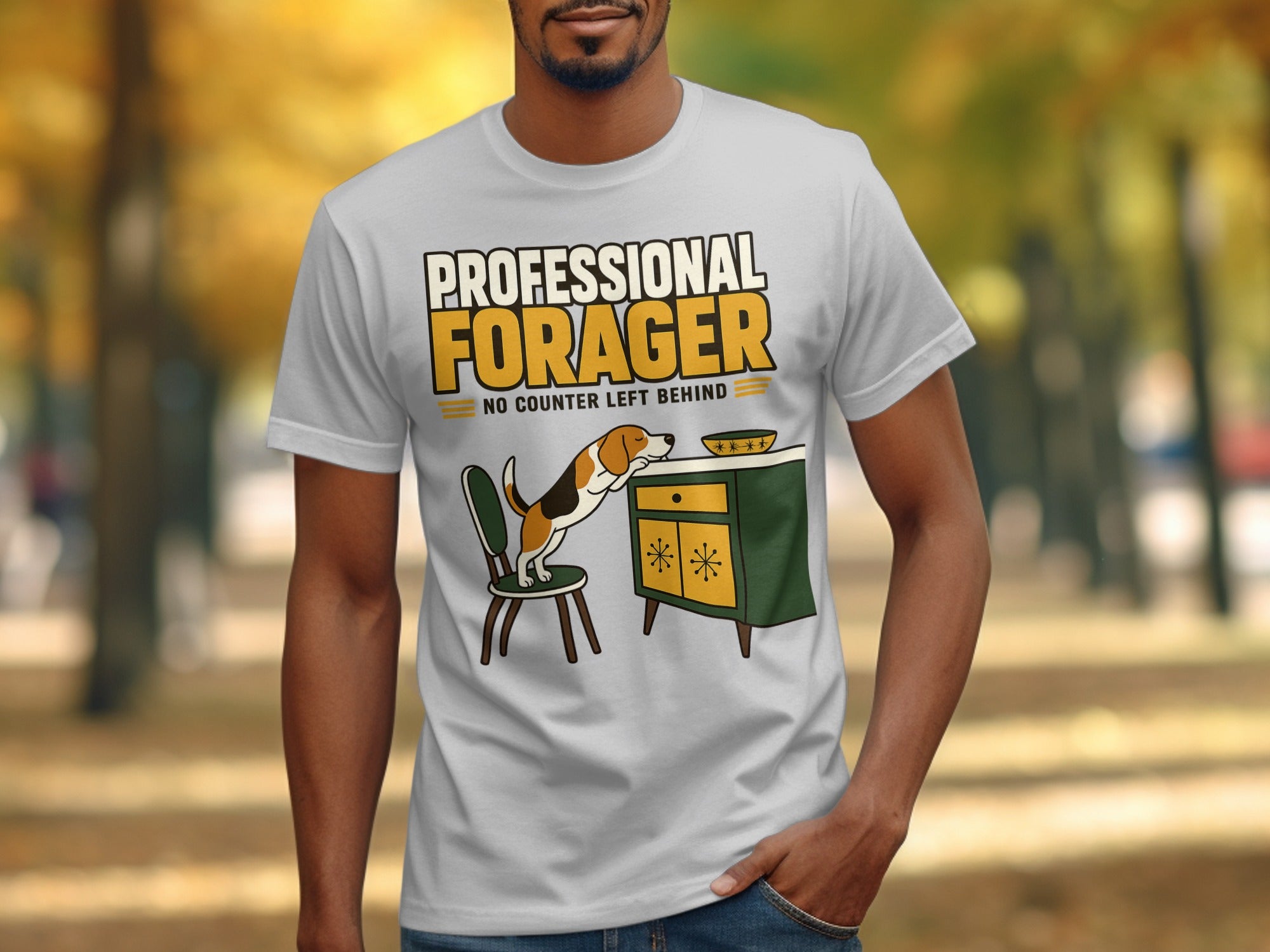 White t-shirt with "Professional Forager" text and a dog on a chair.
