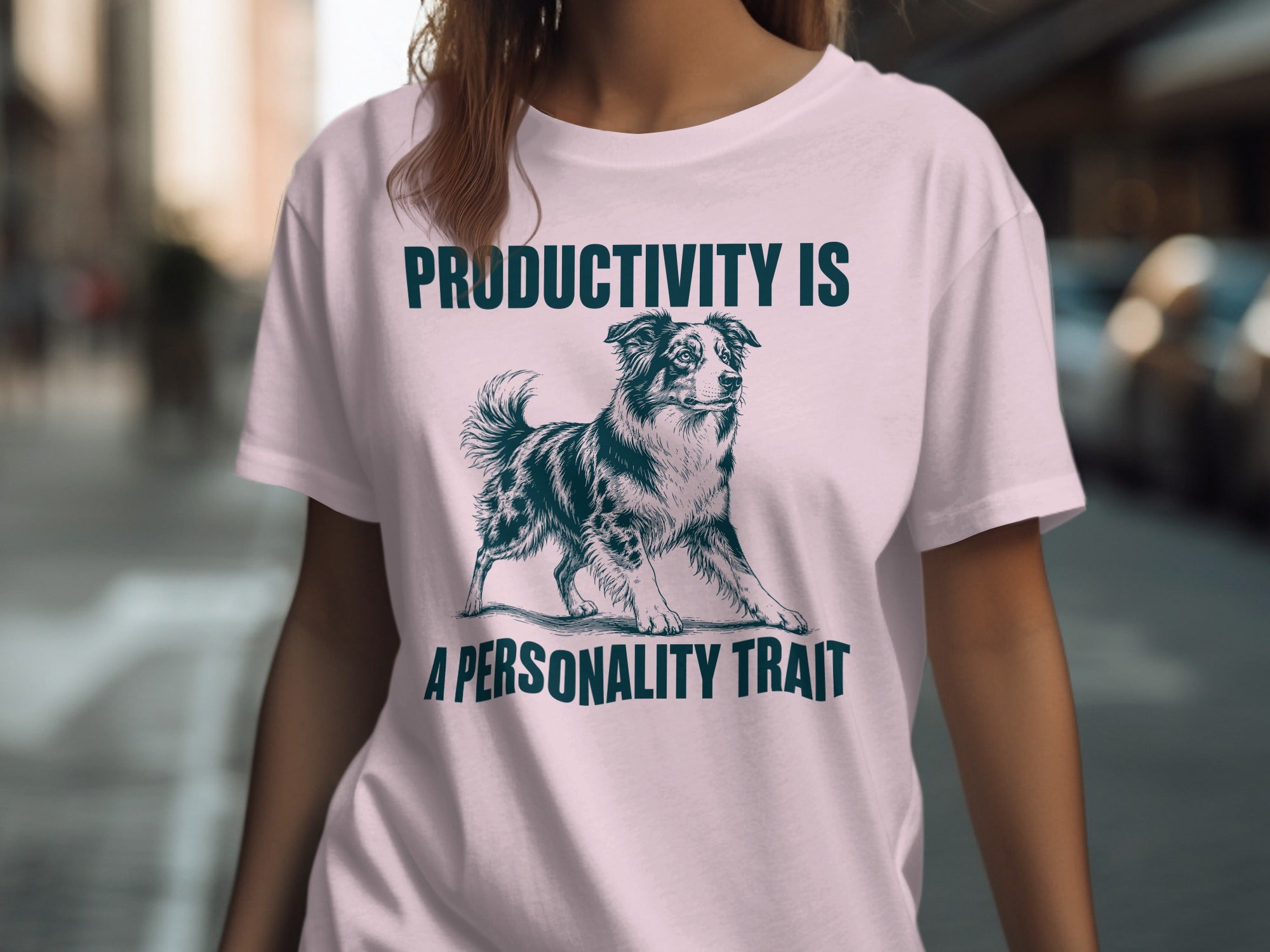 Pink t-shirt with a dog illustration and text "PRODUCTIVITY IS A PERSONALITY TRAIT".