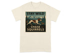 Dog chasing squirrel in mountain landscape with text "STAY WILD CHASE SQUIRRELS".