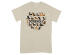 T-shirt with a heart made of dachshunds and paw prints, text reads "DOXIEHOLIC".