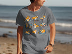 Grey t-shirt featuring a collage of cute corgis engaged in various activities like playing and sewing.