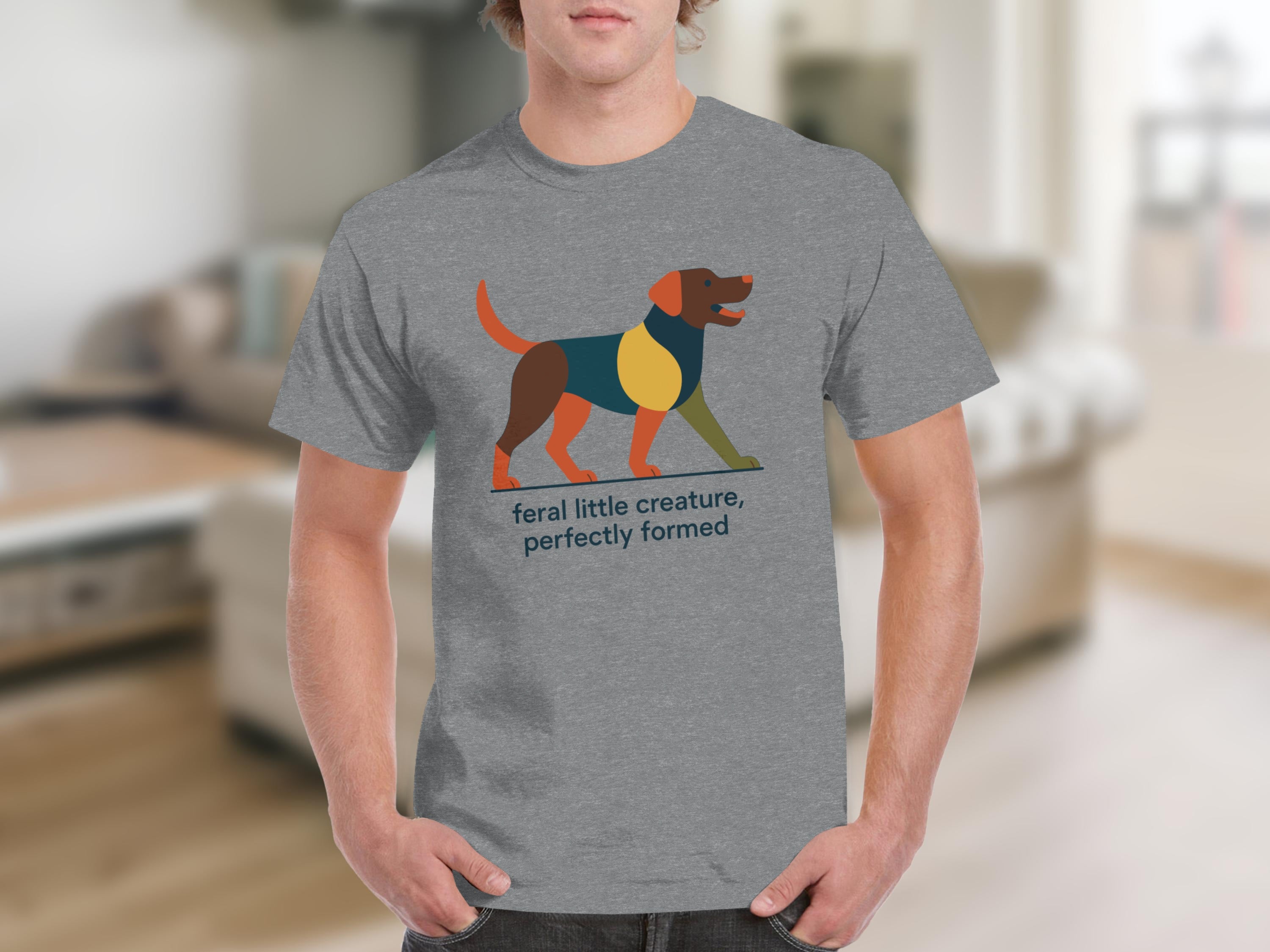 Grey t-shirt with geometric dog graphic and text "feral little creature, perfectly formed".
