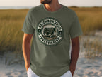 Green t-shirt with "Neighborhood Investigator" text and dog graphic.