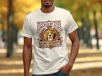 T-shirt featuring a beagle wearing a laurel wreath and the text "POWERED BY SCENT & BAD DECISIONS".