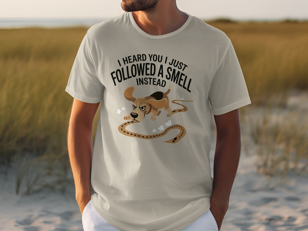 T-shirt with text "I HEARD YOU JUST FOLLOWED A SMELL INSTEAD" and cartoon dog.