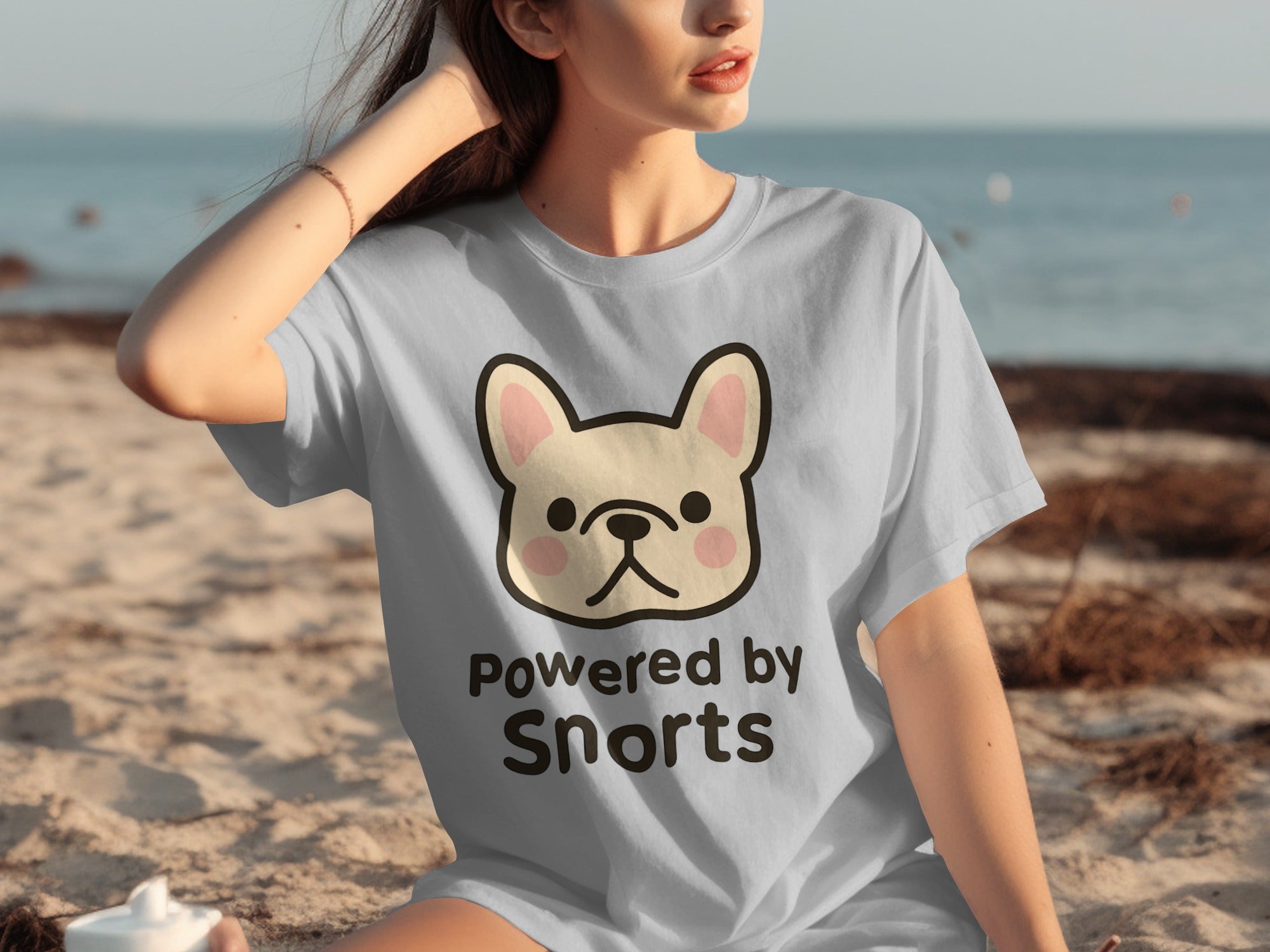 Light blue t-shirt with French bulldog graphic and text "Powered by Snorts."