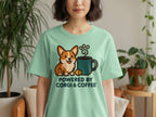 Light green t-shirt with a corgi and coffee cup graphic saying "Powered By CORGI & COFFEE".