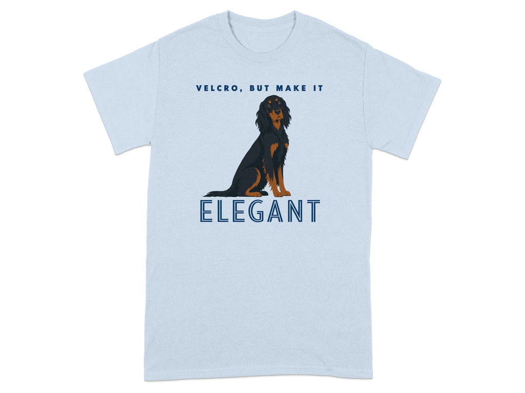 Light blue t-shirt with black dog and text "VELCRO, BUT MAKE IT ELEGANT".