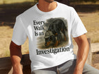 White t-shirt with dog wearing hat and text "Every Walk Is an Investigation".