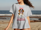 Light gray t-shirt with a beagle wearing pink sunglasses and a bow, reading "First of all, I'm a delight."