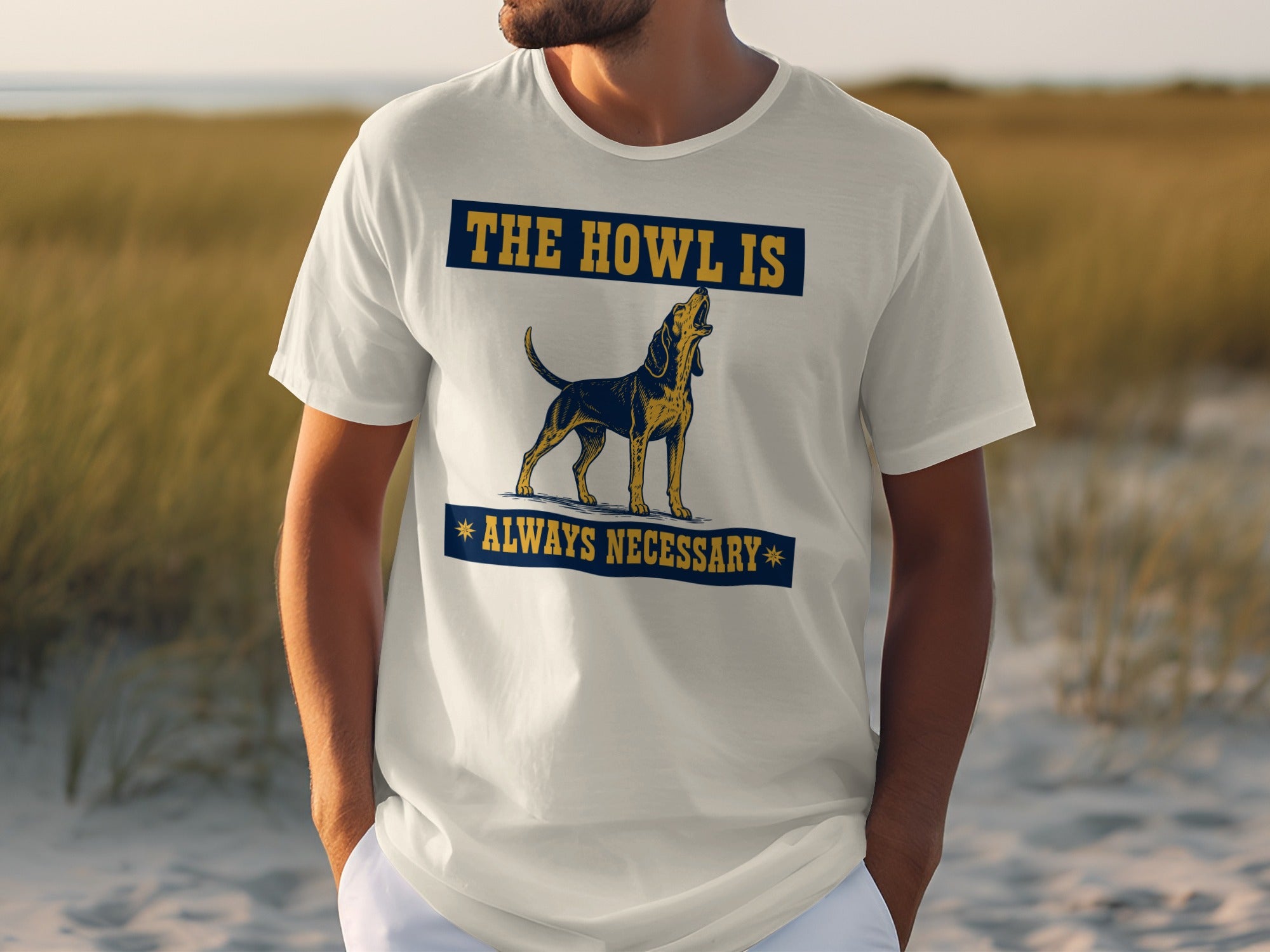 White t-shirt with a dog and text "The howl is always necessary".