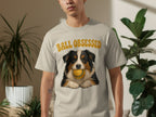 T-shirt with Australian Shepherd dog holding a yellow ball, text "Ball Obsessed".