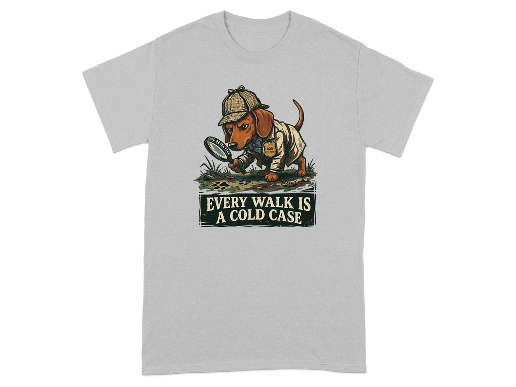Dachshund detective with magnifying glass on t-shirt, reads "Every Walk is a Cold Case".