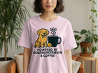 Pink t-shirt with golden retriever, coffee cup, and text reading "POWERED BY GOLDEN RETRIEVER & COFFEE".