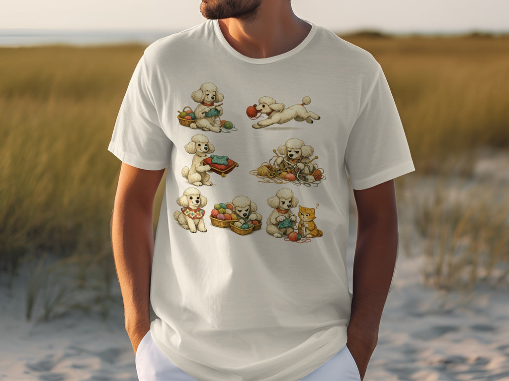 White t-shirt with cartoon poodles knitting and playing with yarn and a cat.