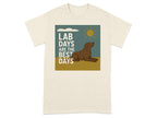 Cream t-shirt with graphic of brown dog, sun, clouds, and text "LAB DAYS ARE THE BEST DAYS".