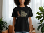 Black t-shirt with "EAT. SLEEP. ZOOMIES. REPEAT." and a dog silhouette.