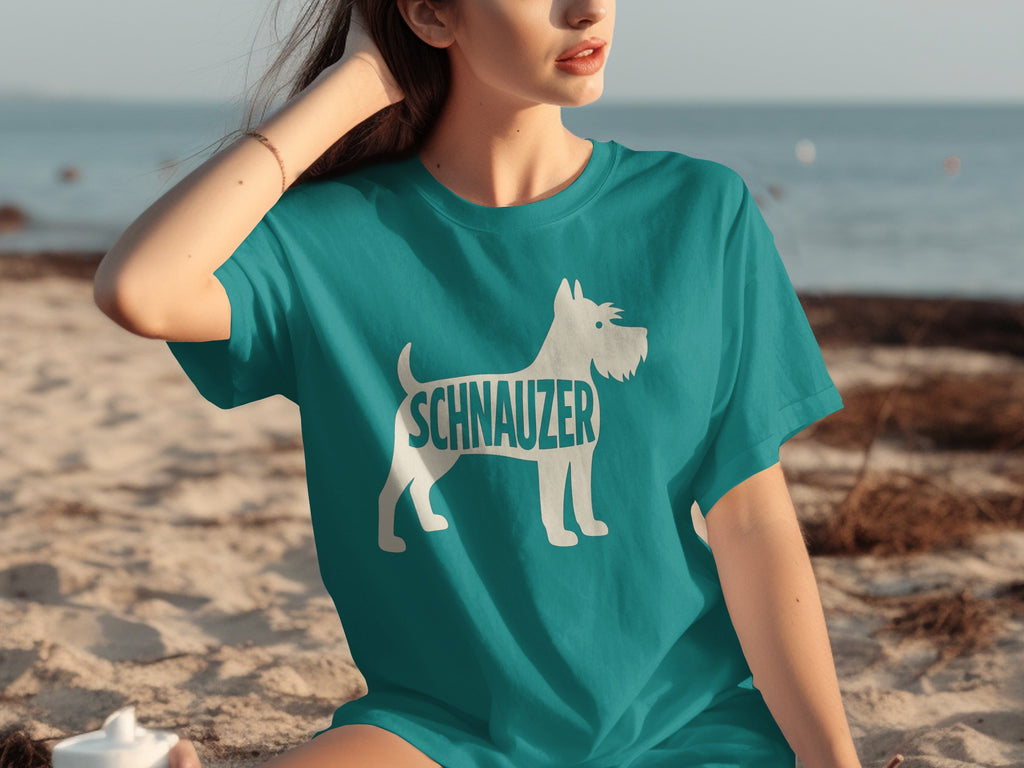 Teal t-shirt with white Schnauzer dog silhouette and text.