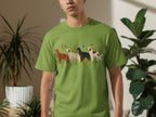 Green t-shirt featuring a line of four colorful dogs with stars and moons.