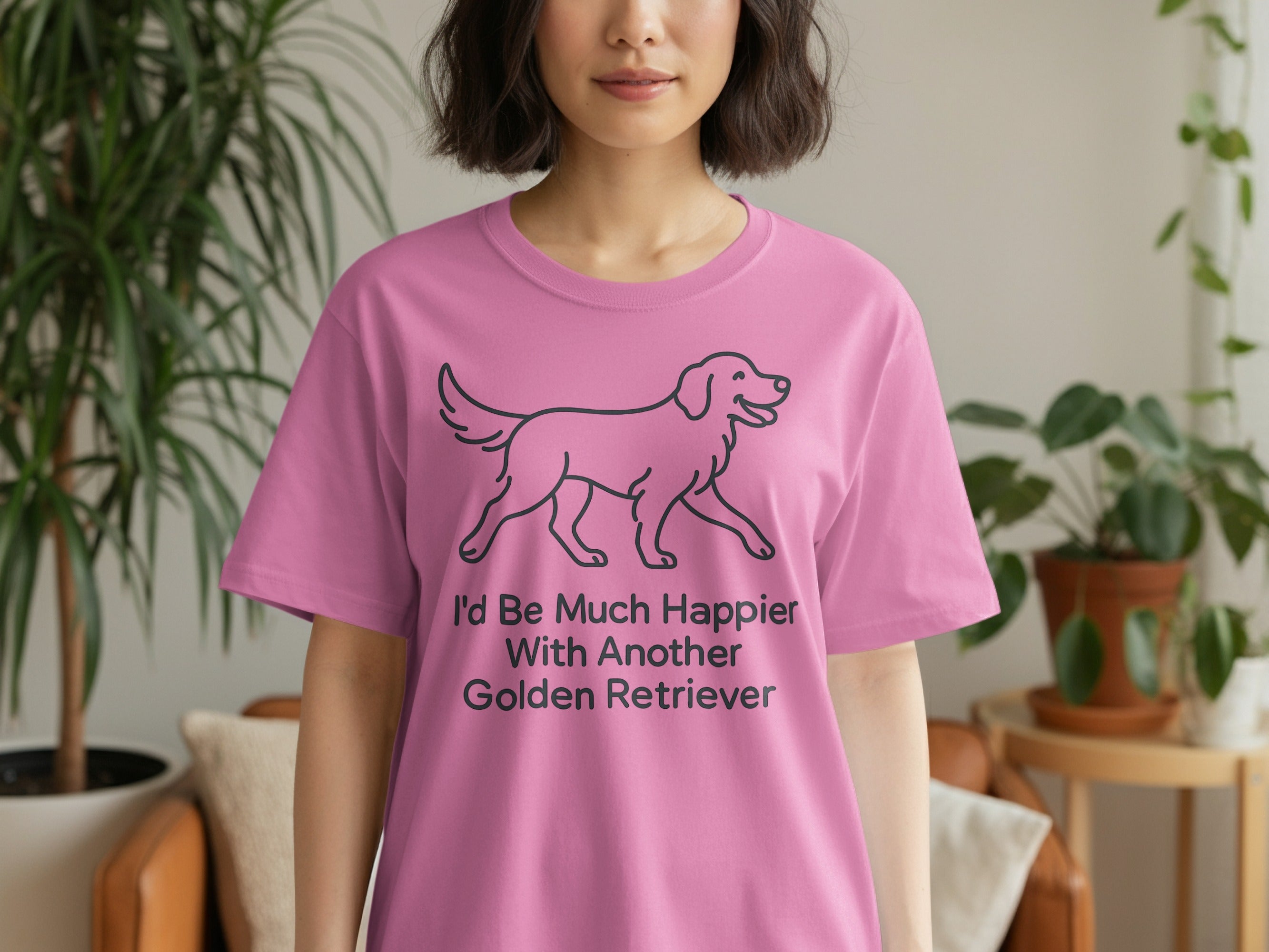 Pink t-shirt with black line drawing of a golden retriever and text "I'd Be Much Happier With Another Golden Retriever."