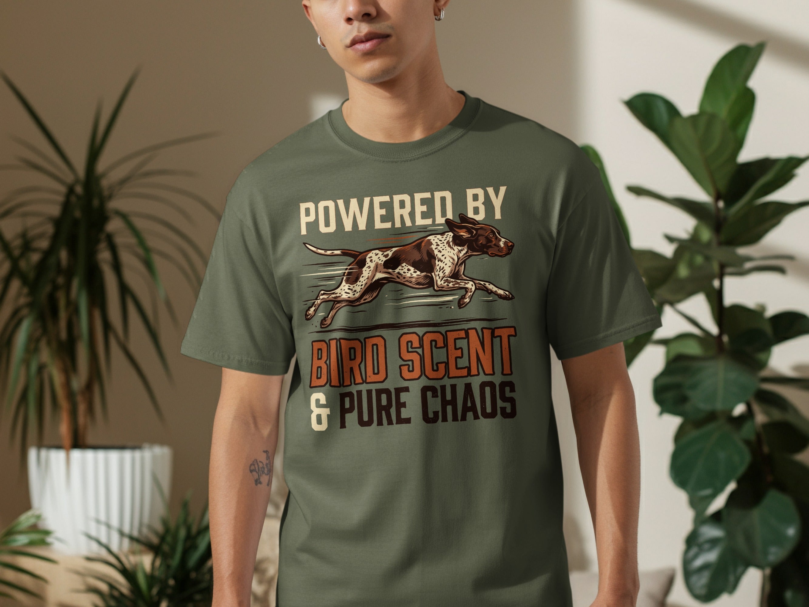 T-shirt with "Powered by Bird Scent & Pure Chaos" text and dog graphic.