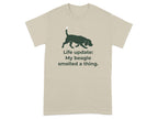 Beagle dog silhouette on a beige t-shirt with text "Life update: My beagle smelled a thing."