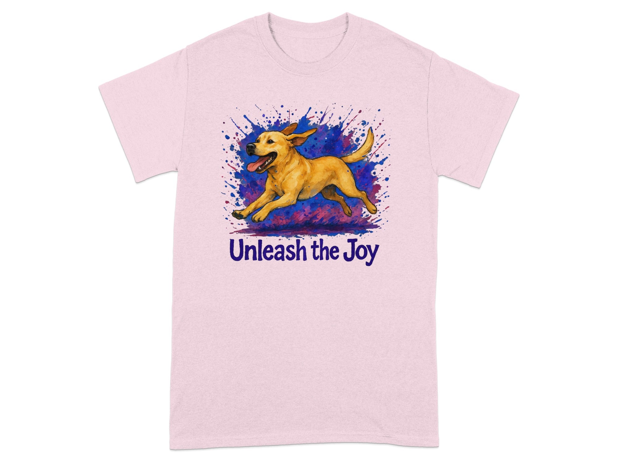 Pink t-shirt with a running yellow dog and purple blue paint splatters. Text reads "Unleash the Joy".