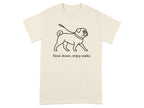 T-shirt with pug illustration and text "Slow down, enjoy walks".