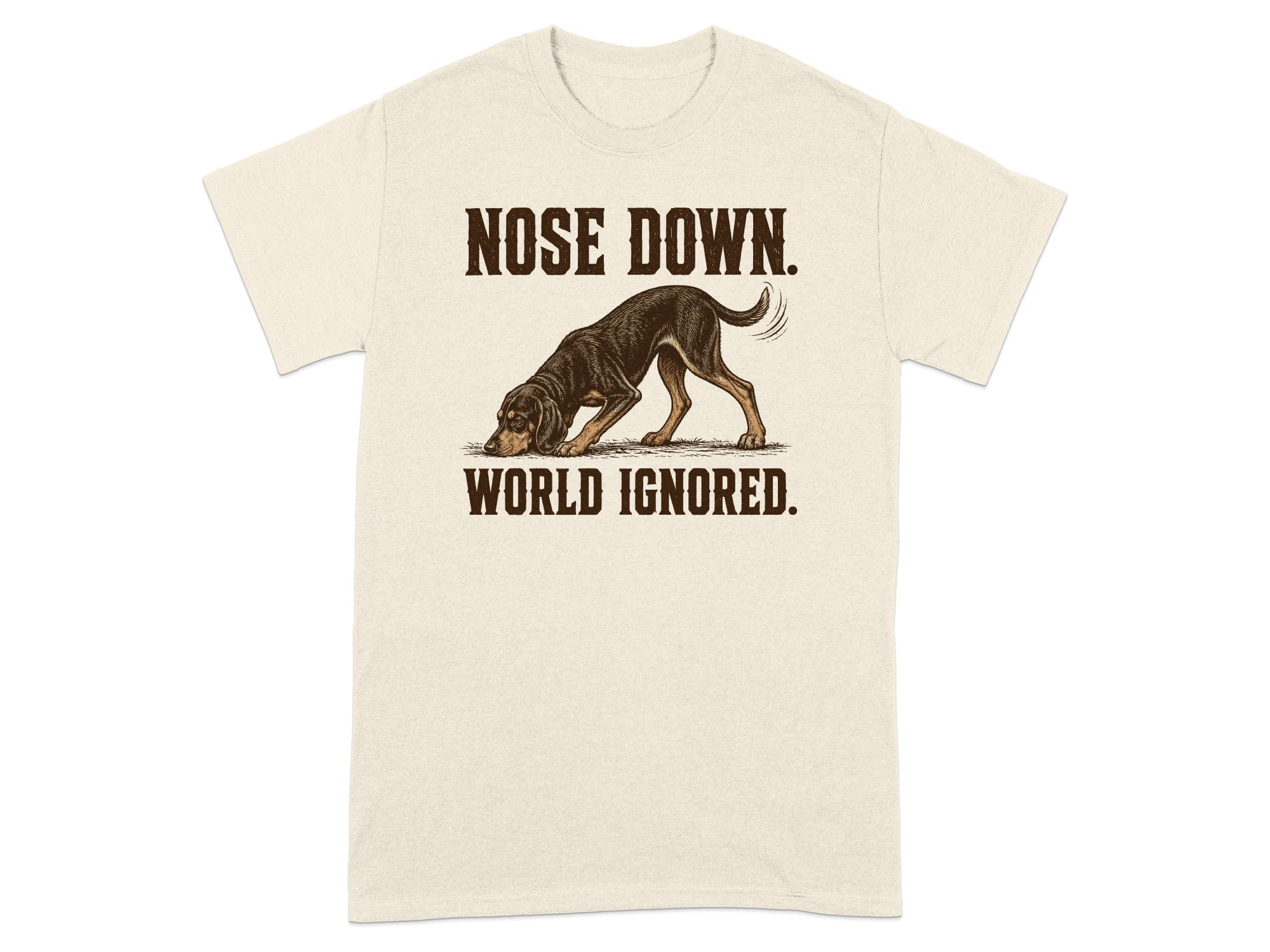 Cream t-shirt with dog sniffing ground and text "NOSE DOWN. WORLD IGNORED."