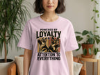 Pink t-shirt with "Powered by Loyalty & Attention to Everything" and two German Shepherds.