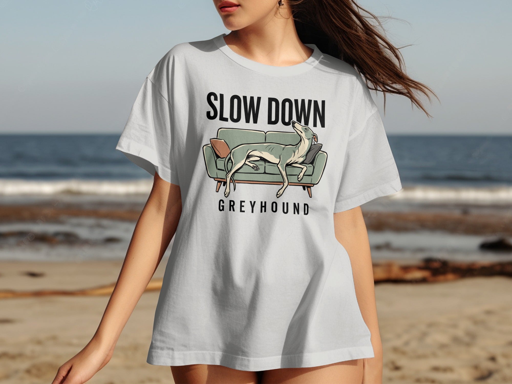 Light grey t-shirt with "SLOW DOWN GREYHOUND" and a dog on a couch graphic.