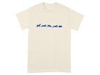 Cream t-shirt with blue dogs chasing a sleeping dog graphic.
