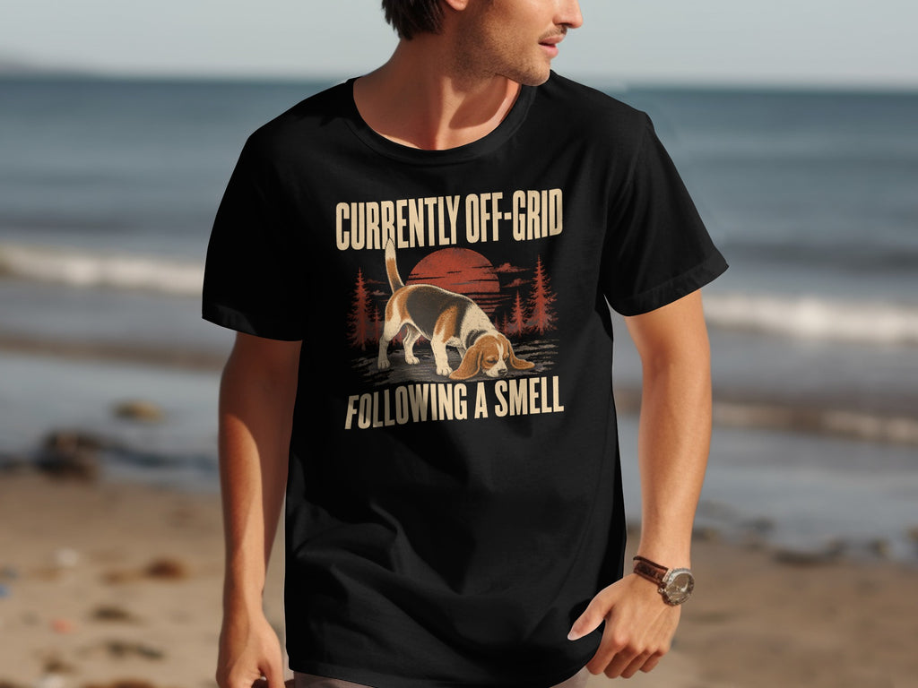Black t-shirt with text "CURRENTLY OFF-GRID FOLLOWING A SMELL" and beagle graphic.