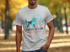 T-shirt with a dog graphic and text "POWERED BY SCENT & BAD DECISIONS".