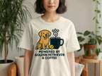 Cream t-shirt with "Powered by Golden Retriever & Coffee" and illustration of a dog and coffee cup.