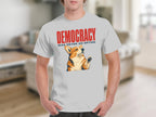 White t-shirt with "DEMOCRACY WAS NEVER AN OPTION" and a corgi raising paw.
