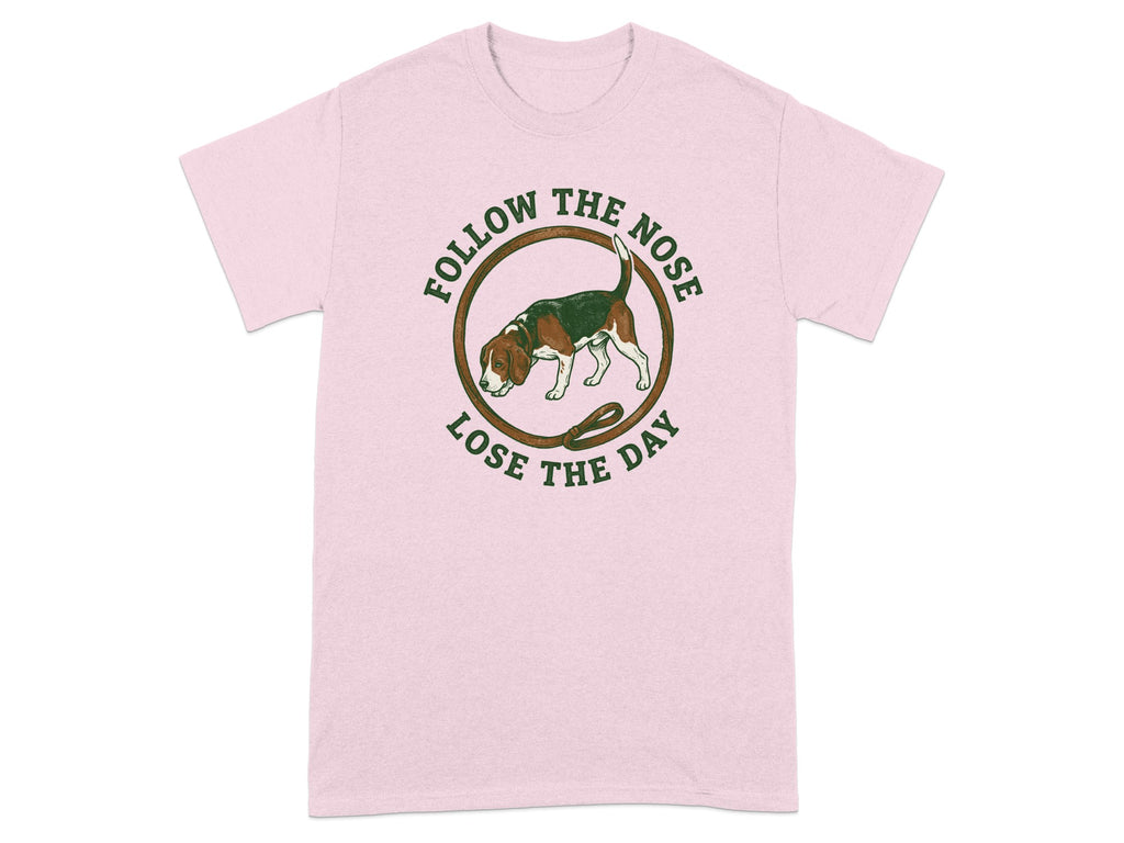 Pink t-shirt with beagle and text "FOLLOW THE NOSE LOSE THE DAY".