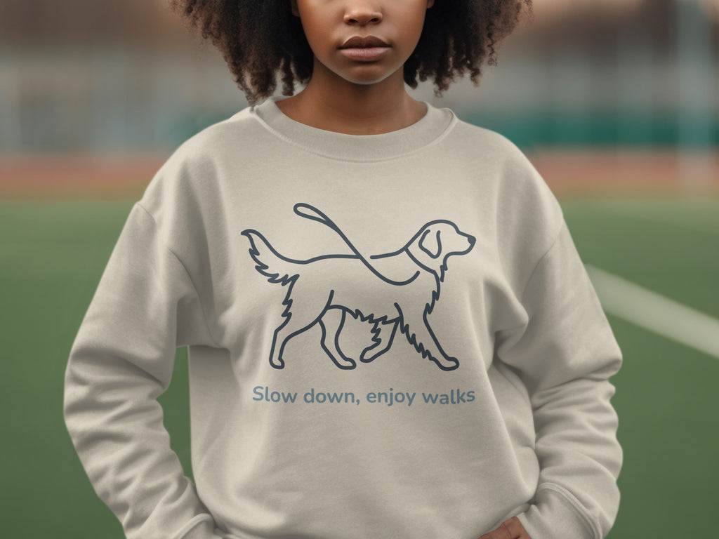 Light gray sweatshirt with dog silhouette and text "Slow down, enjoy walks".