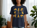 T-shirt with a repeating pattern of cartoon golden retrievers sewing, napping, and playing with fabric.