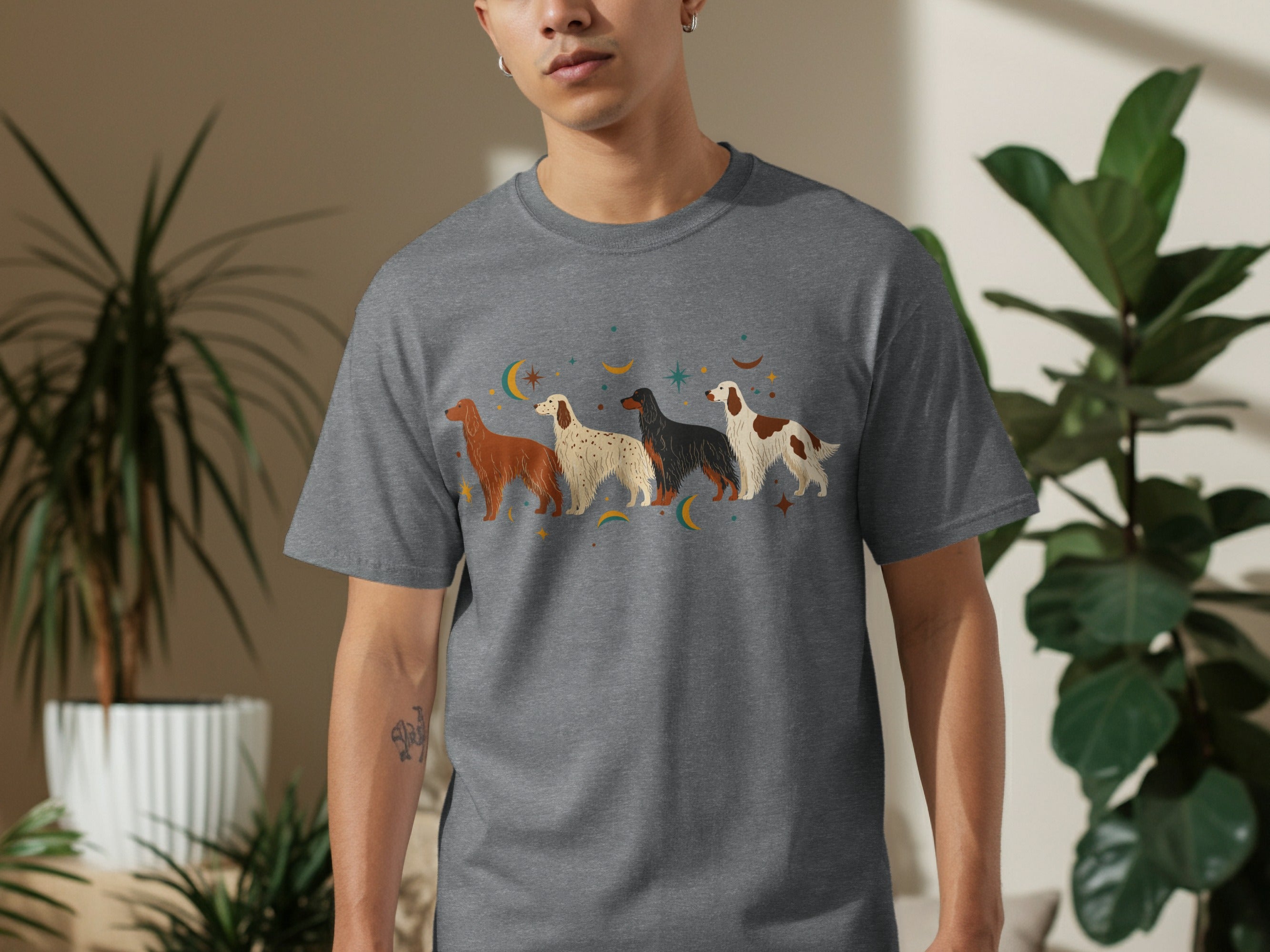 Grey t-shirt with four illustrated dogs and stars graphic.