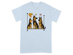 Three stylized German Shepherd dogs sit in a row on a shelf with abstract shapes.