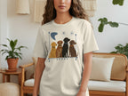 Cream t-shirt with cartoon dogs sitting in a row with moon and stars.