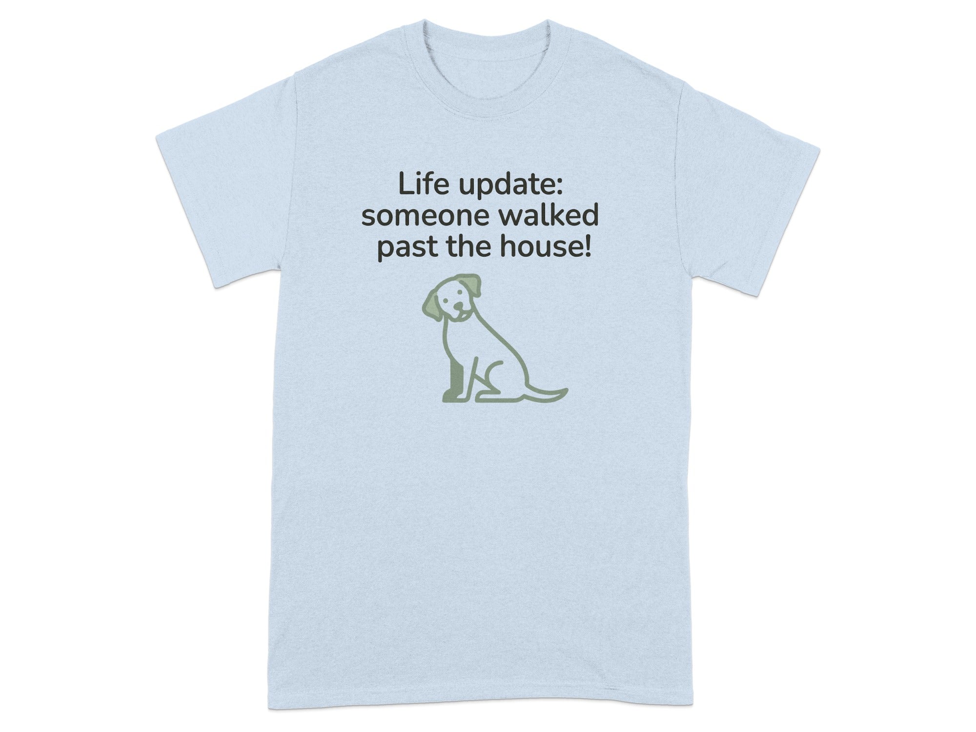 Light blue t-shirt with green dog graphic and text "Life update: someone walked past the house!"