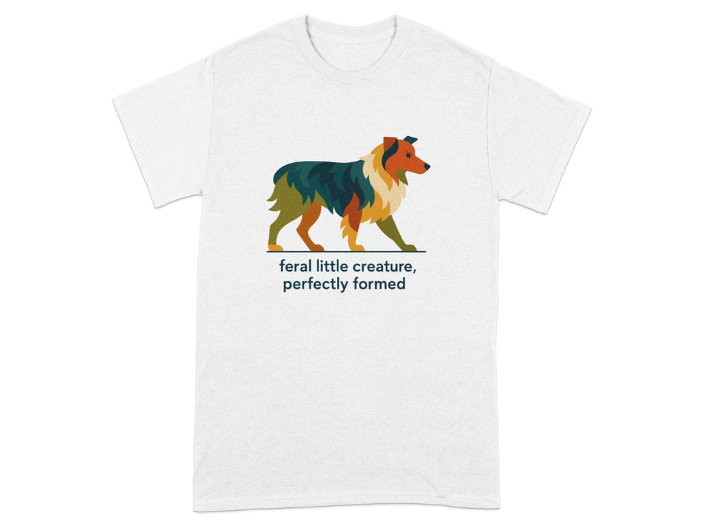White t-shirt with stylized dog illustration and text "feral little creature, perfectly formed".