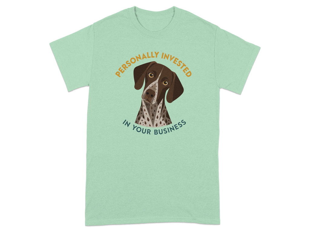 Dog wearing shirt that says "Personally Invested in Your Business."