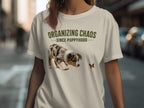 Beige t-shirt with "Organizing Chaos Since Puppyhood" text and a dog looking at a butterfly.