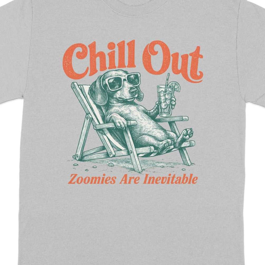 Grey t-shirt with dog in lounge chair, wearing sunglasses, holding drink. Text reads "Chill Out".